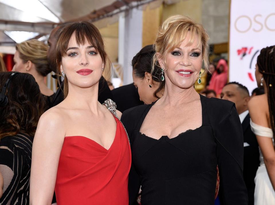 Johnson with her mother, Hollywood star Melanie Griffith, attend the 87th Annual Academy Awards (Getty Images)
