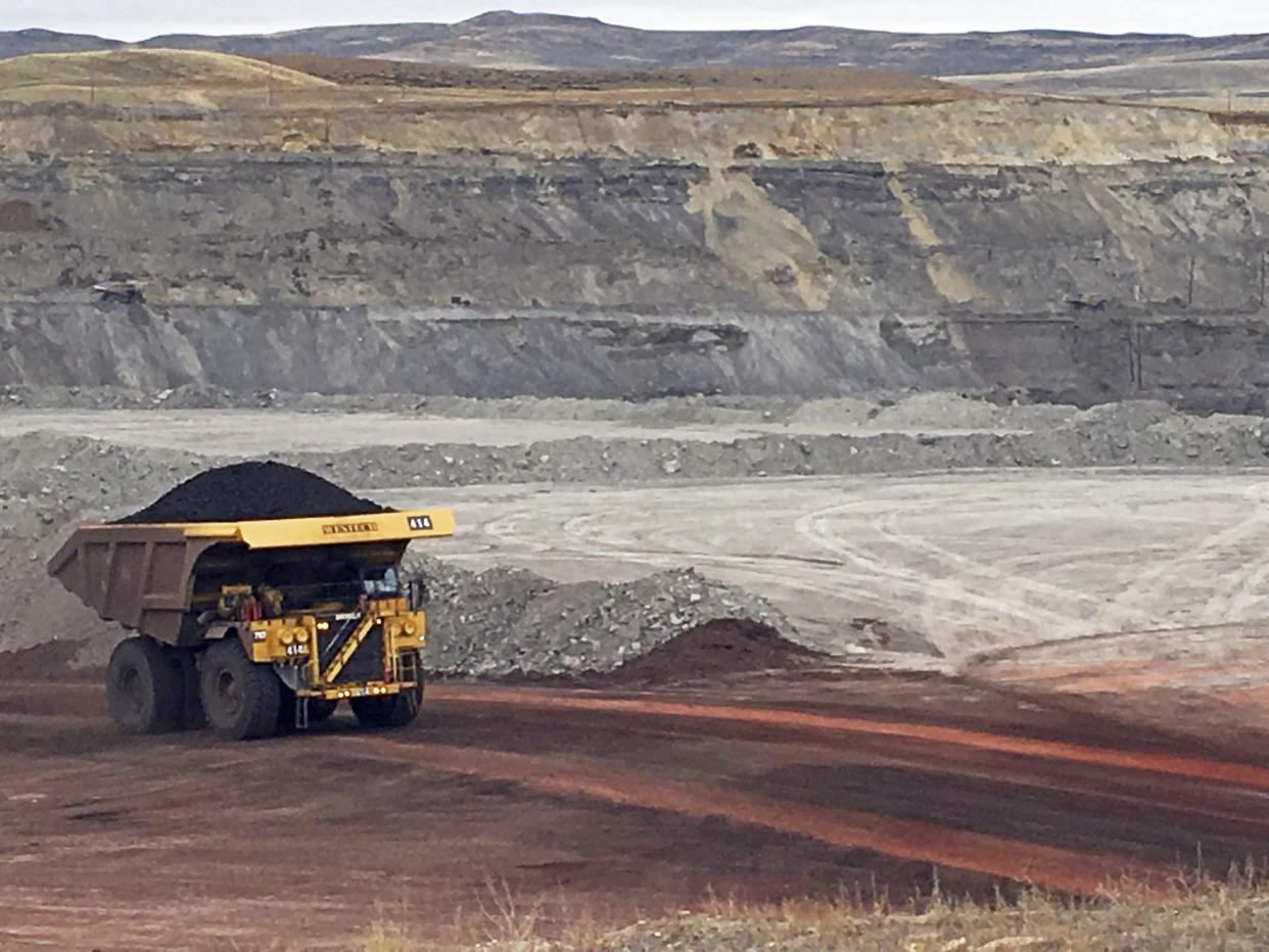 FILE - In this March 28, 2017 file photo, a dump truck hauls coal at Contura Energy's Eagle Butte Mine near Gillette, Wyo. 