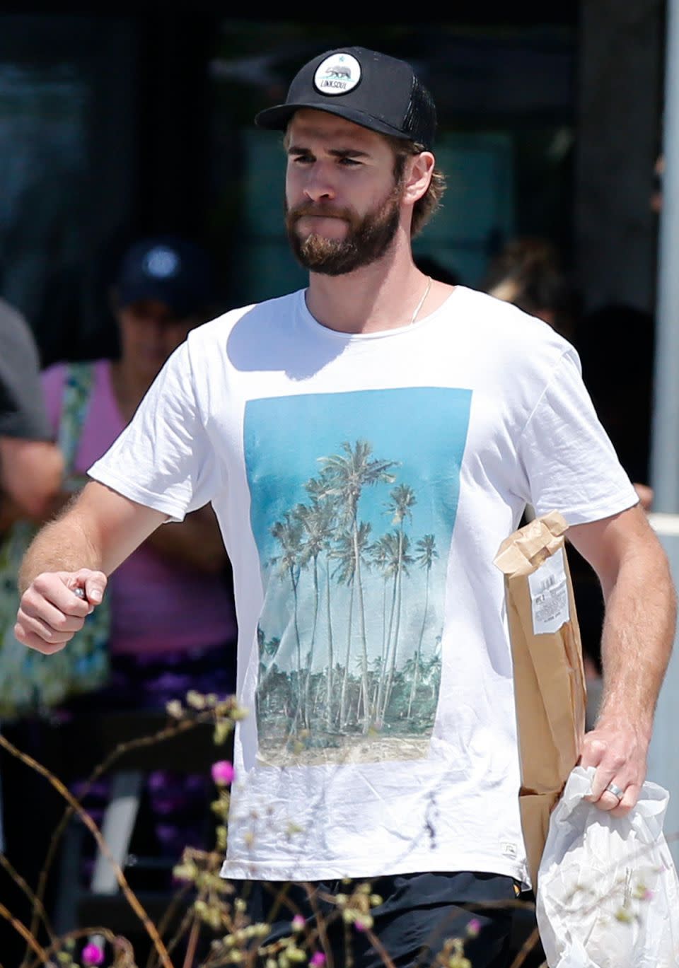 Liam Hemsworth has been seen sporting a band on his ring finger while out and about running some errands. Source: Mega