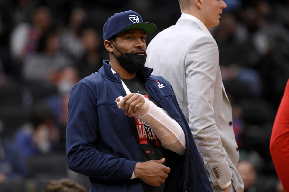 Washington Wizards guard Bradley Beal stands during a timeout in the first half of the team's NBA basketball game against the Sacramento Kings, Saturday, Feb. 12, 2022, in Washington. Beal is out for the season with a wrist injury. (AP Photo/Nick Wass)