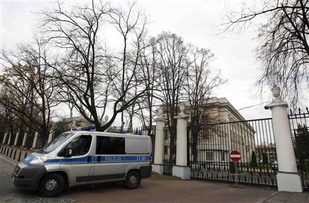 A police vehicle is parked in front of the Russian embassy compound in Warsaw, November 12, 2013. REUTERS/Kacper Pempel