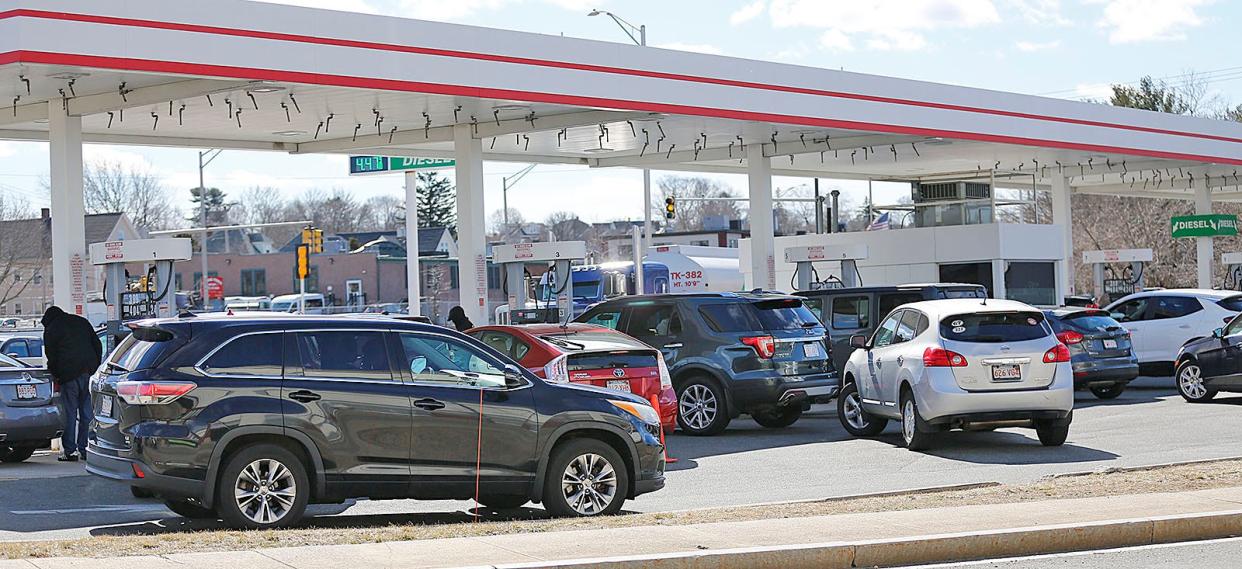 Drivers line up for gas at the BJ's Club gas station in Quincy on Tuesday, March 8, 2022.