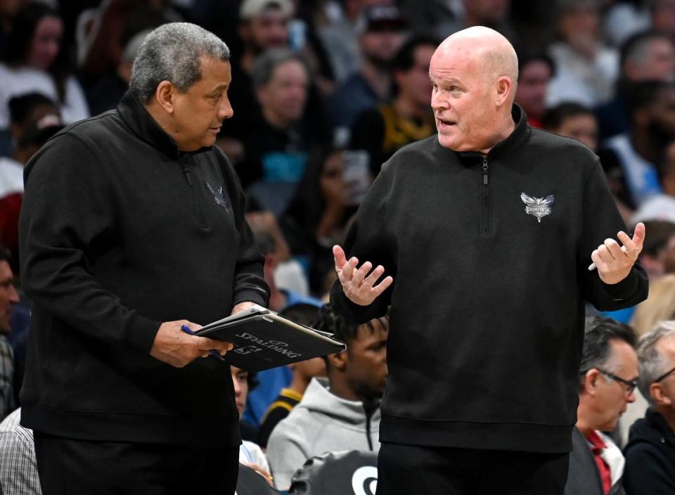 Charlotte Hornets head coach Steve Clifford, right, speaks with assistant coach Bob Beyer, left, during first half action against the Los Angeles Lakers on Monday, February 5, 2024 at Spectrum Center in Charlotte, NC.