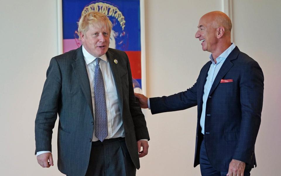 Prime Minister Boris Johnson (left) meets with Amazon founder Jeff Bezos during the United Nations General Assembly in New York - Stefan Rousseau /PA