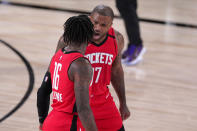 Houston Rockets' P.J. Tucker (17) celebrates with Ben McLemore (16) during the second half of an NBA conference semifinal playoff basketball game against the Los Angeles Lakers Sunday, Sept. 6, 2020, in Lake Buena Vista, Fla. (AP Photo/Mark J. Terrill)