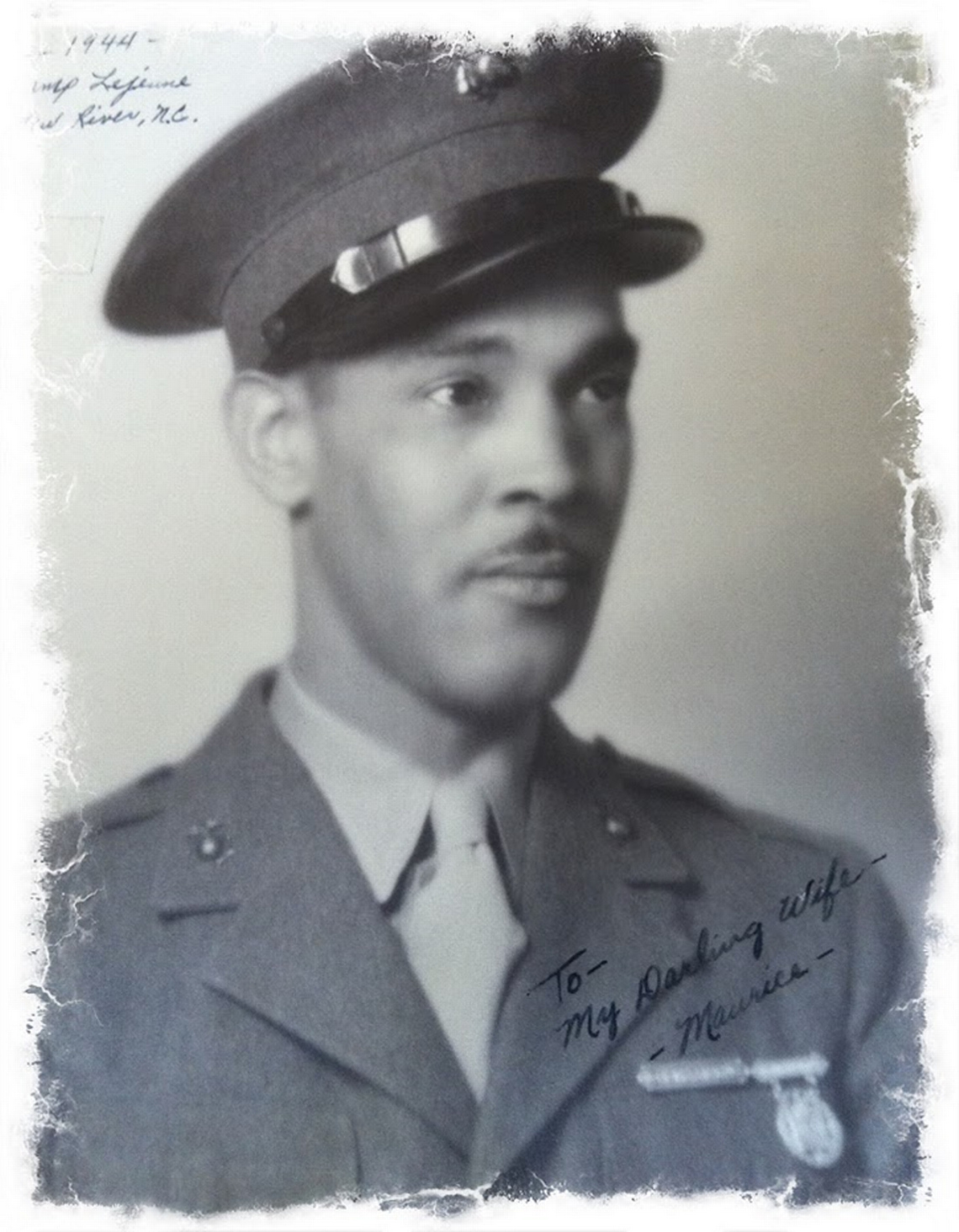 A photo of Marine Corps Pvt. Maurice Burns with a note to his wife written on it.