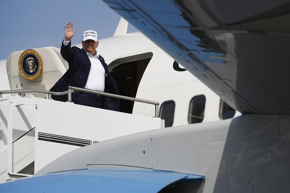 President Donald Trump boards Air Force One at Morristown Municipal Airport in Morristown, N.J., Sunday, July 26, 2020. Trump is returning to Washington after spending the weekend at his golf club in nearby Bedminster, N.J. (AP Photo/Patrick Semansky)