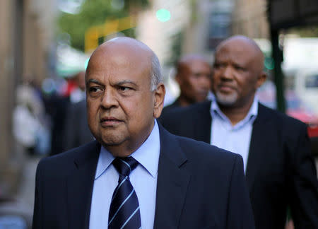 FILE PHOTO: South Africa's Finance Minister Pravin Gordhan walks with his deputy, Mcebisi Jonas as they walk from their offices to a court hearing in Pretoria, South Africa, March 28, 2017. REUTERS/Siphiwe Sibeko