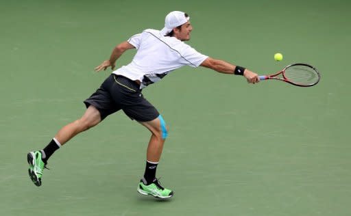 Tommy Haas of Germany hits a backhand against David Nalbandian of Argentina during day four of the Western & Southern Open at Lindner Family Tennis Center. Haas continued his fighting return to top form which has erupted in the last few months, with the 34-year-old outlasting Nalbandian in a marathon lasting almost 3 1/2 hours