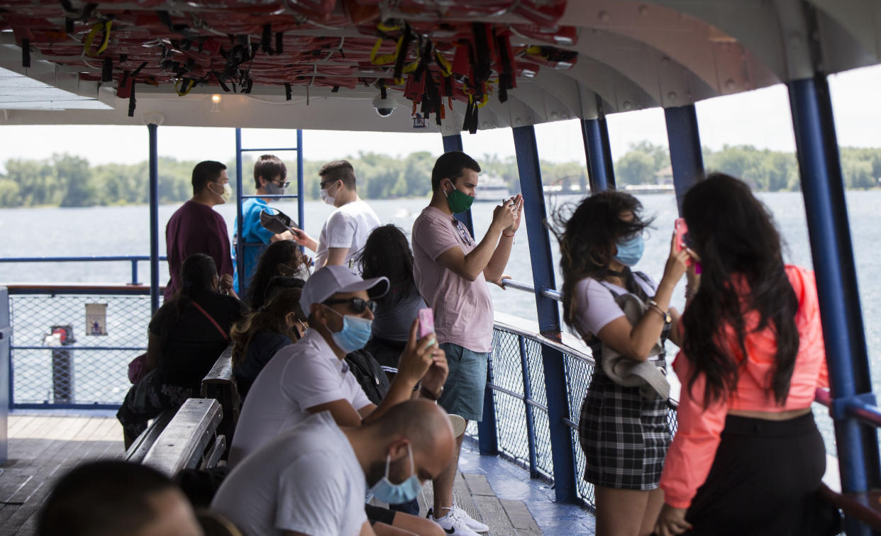 TORONTO, June 27, 2020 -- Passengers wearing face masks are seen on a ferry in Toronto, Canada, on June 27, 2020. Ferry service to the Toronto Islands resumed for the public starting on Saturday, with passengers required to wear face masks or coverings. (Photo by Zou Zheng/Xinhua via Getty) (Xinhua/Zou Zheng via Getty Images)