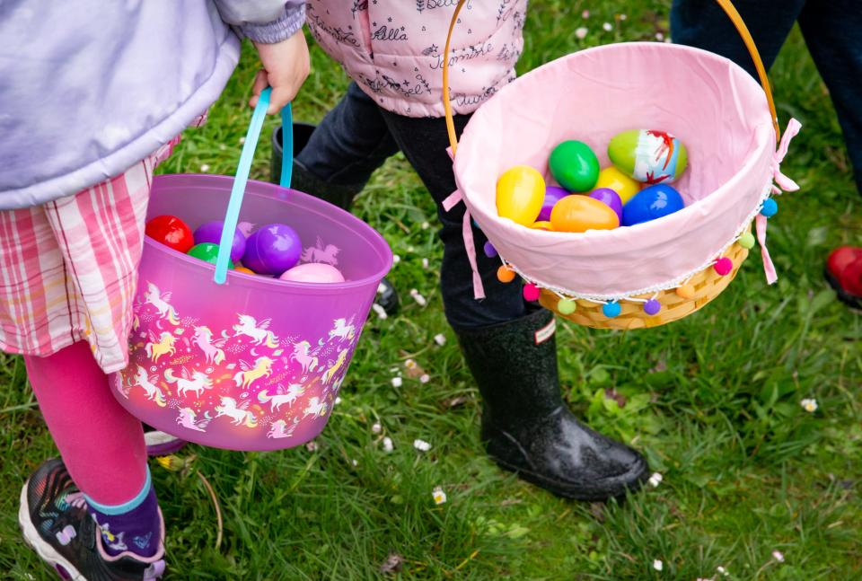 Kids clutch their egg baskets at Willamalane’s annual “Megga” Easter egg hunt at Lively Park in Springfield in April 2023.