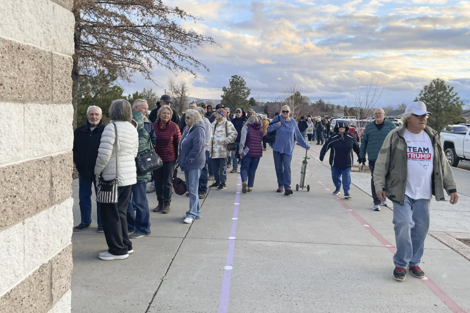 People wait in line to enter the caucus site at Spanish Springs Elementary School in Sparks, Nev., Thursday, Feb. 8, 2024. (AP Photo/Gabe Stern)
