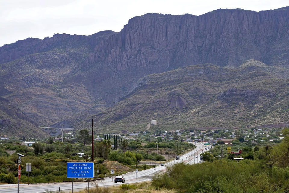 Apache Leap Mountain hovers over Superior, Ariz., Friday, June 9, 2023. The historic mining town in central Arizona is the subject of a tug of war between locals who want a copper mine developed nearby for economic benefit and Native American groups who say the land needed for mining is sacred and should be protected. (AP Photo/Matt York)