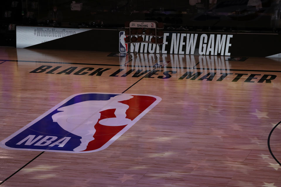 LAKE BUENA VISTA, FLORIDA - JULY 30: A general view the court with Black Lives Matter written above the NBA logo is seen at center court prior to the game between the LA Clippers and the Los Angeles Lakers at The Arena at ESPN Wide World Of Sports Complex on July 30, 2020 in Lake Buena Vista, Florida. NOTE TO USER: User expressly acknowledges and agrees that, by downloading and or using this photograph, User is consenting to the terms and conditions of the Getty Images License Agreement. (Photo by Mike Ehrmann/Getty Images)