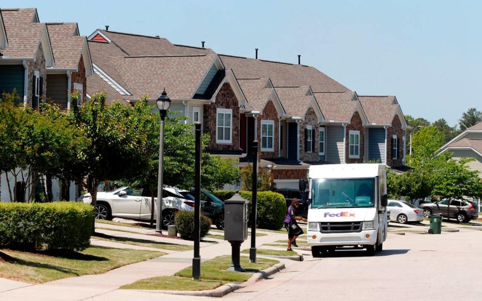 Townhomes line Mountain Pine Drive in Cary, N.C., Tuesday, April 27, 2021.