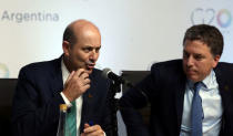 Argentina's Central Bank President Federico Sturzenegger speaks next to Argentina's Treasury Minister Nicolas Dujovne during a news conference at the G20 Meeting of Finance Ministers in Buenos Aires, Argentina, March 20, 2018. REUTERS/Marcos Brindicci