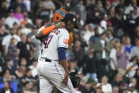 Houston Astros catcher Martin Maldonado talks with relief pitcher Rafael Montero during the eighth inning of the team's baseball game against the Chicago White Sox on Monday, Aug. 15, 2022, in Chicago. (AP Photo/Charles Rex Arbogast)