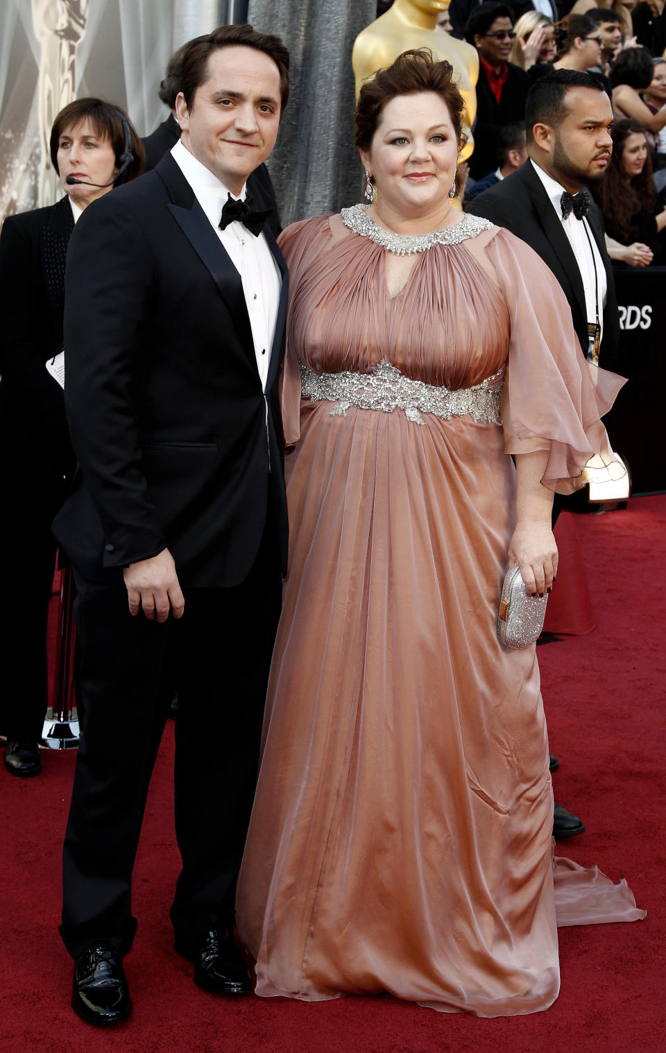 Ben Falcone, left, and Melissa McCarthy arrive before the 84th Academy Awards on Sunday, Feb. 26, 2012, in the Hollywood section of Los Angeles. (AP Photo/Matt Sayles)