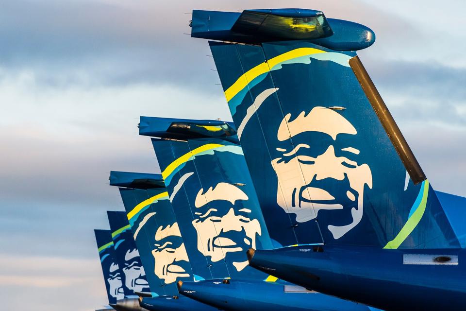 Alaska Airlines planes lined up at an airport