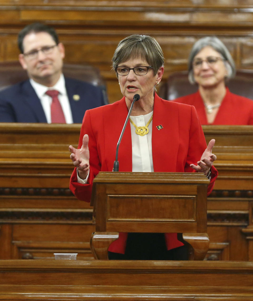 Kansas Gov. Laura Kelly gives her first State of the State address to lawmakers on the floor of the Kansas House on Wednesday, Jan. 16, 2019, in Topeka, Kan. (Chris Neal/The Topeka Capital-Journal via AP)
