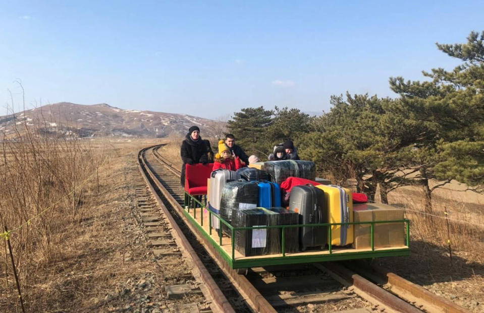 Image: Russian diplomats and family members leave North Korea to Russia using a hand-pushed rail trolley due to Pyongyang's coronavirus restrictions (Russian Foreign Ministry / AFP - Getty Images)