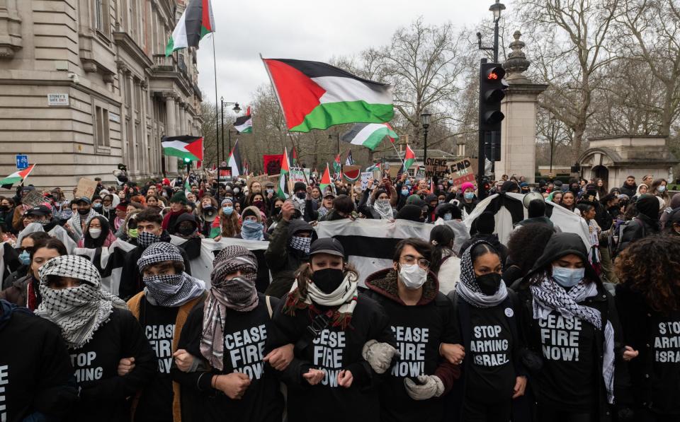 Protesters wore headscarves and face masks