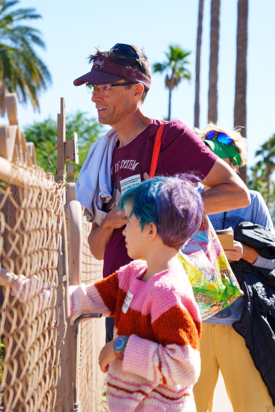 Dan Hunt canvases for the Environmental Voter Project along with his daughter, Everest Sipp on Oct. 29, 2022, in Tucson.