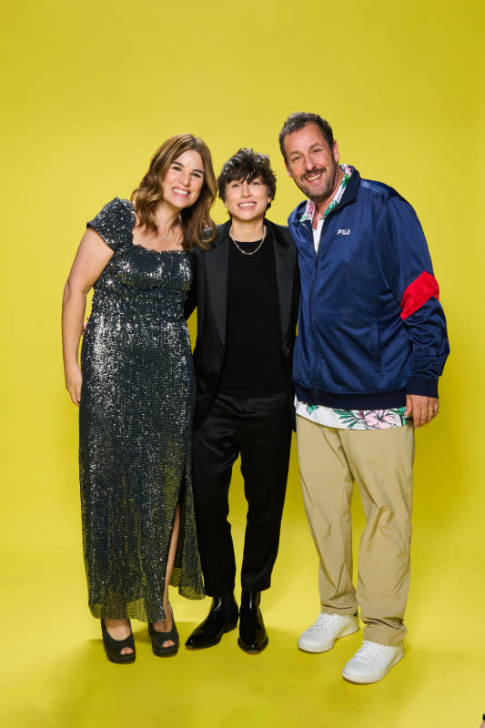 <p>Cara Robbins/Getty Images for Family Film and TV Awards</p><p>Elysa Dutton, Sammi Cohen and Adam Sandler at the Family Film And TV Awards 2024.</p>