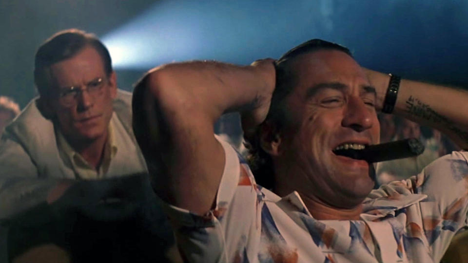 Max Cady (Robert De Niro) and Sam Bowden (Nick Nolte) sitting in a movie theater in Cape Fear.