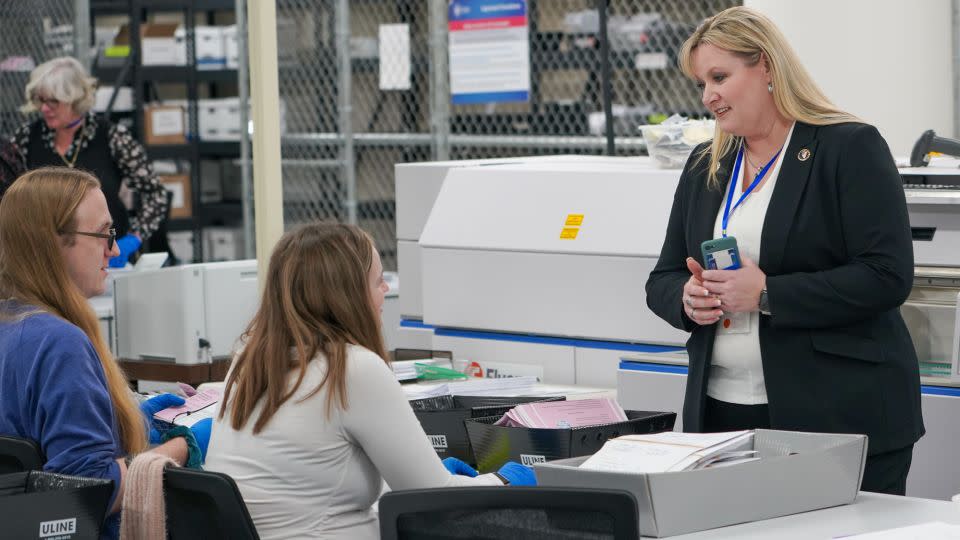 Burgess speaks with election workers at the Washoe County registrar of voters office on February 6, 2024. - Trevor Hughes/USA Today Network