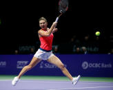 Tennis - Singapore WTA Finals Round Robin Singles - Singapore Indoor Stadium, Singapore - 25/10/2016 - Simona Halep of Romania in action against Angelique Kerber of Germany. REUTERS/Edgar Su