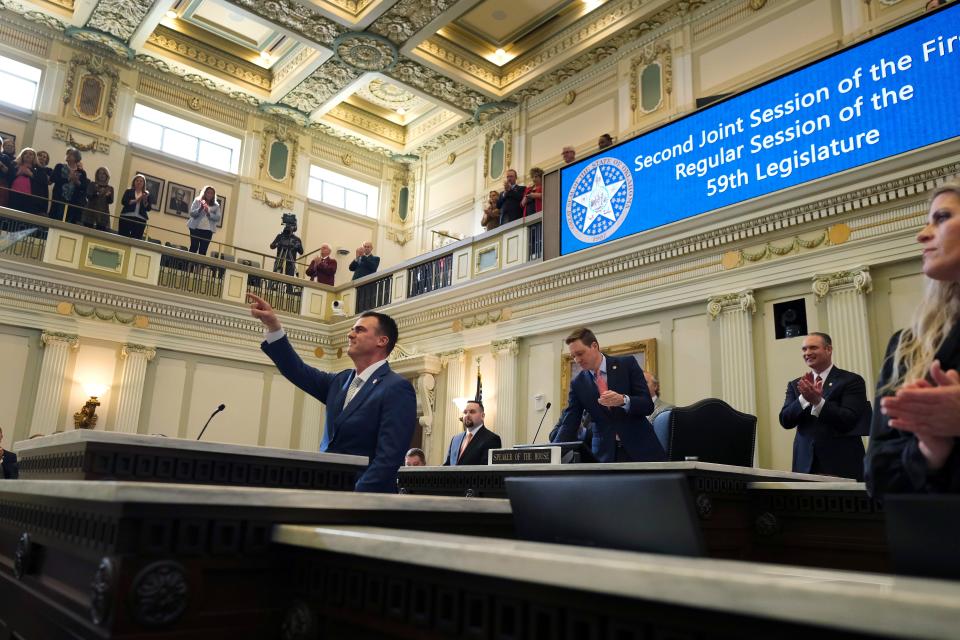 Gov. Kevin Stitt acknowledges someone in the gallery Feb. 6 during the start of the Legislature and his State of the State speech to the joint session.