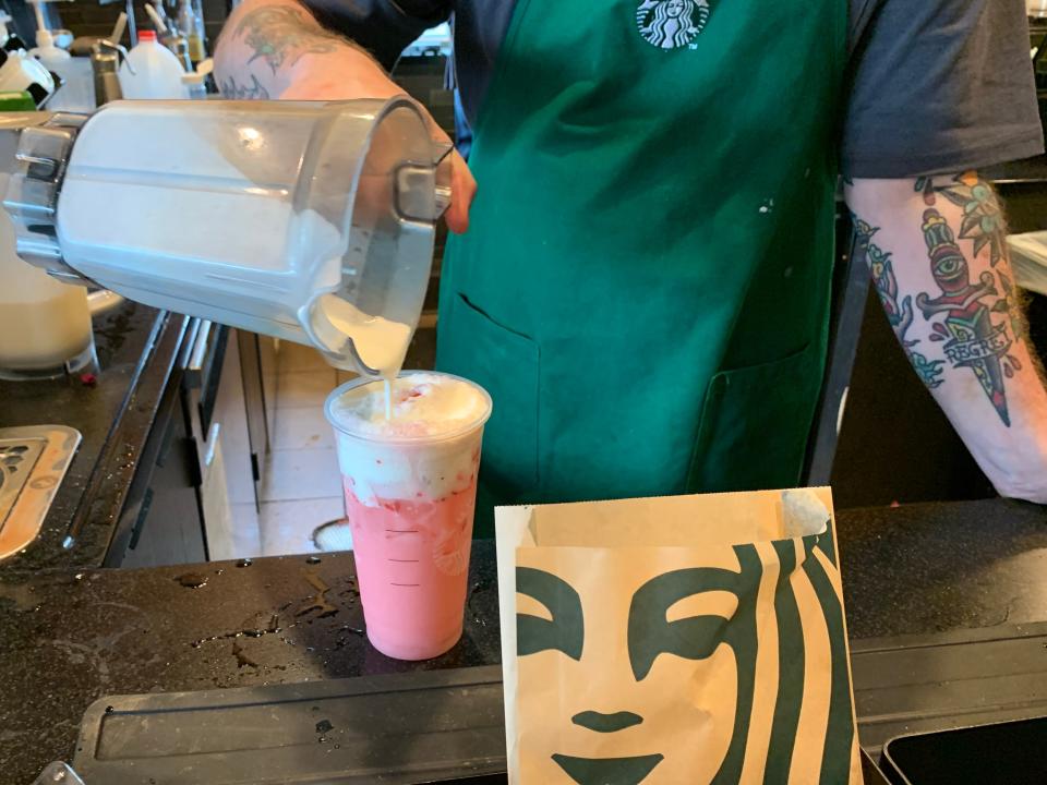Starbucks Pink Drink Remixed being made by barista