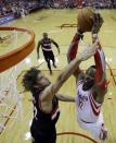 Houston Rockets' Dwight Howard (12) dunks against Portland Trail Blazers' Robin Lopez (42) during the first half in Game 2 of an opening-round NBA basketball playoff series Wednesday, April 23, 2014, in Houston. (AP Photo/David J. Phillip)