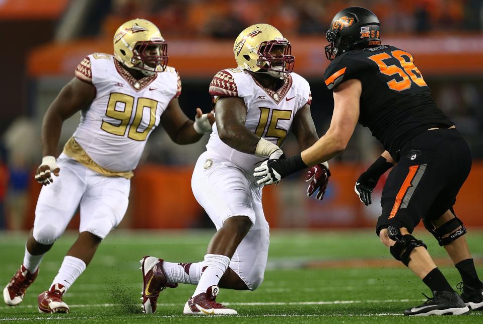 Florida State defensive linemen Eddie Goldman (90) and Mario Edwards Jr. (15) are both headed to the NFL after their junior seasons with the Seminoles.