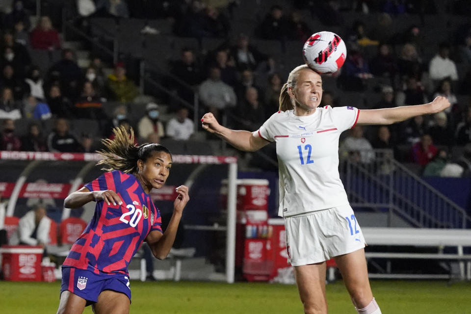 Czech Republic's Klara Cahynova, right, heads the ball next to United States' Catarina Macario during the first half of a She Believes Cup soccer match Thursday, Feb. 17, 2022, in Carson, Calif. (AP Photo/Marcio Jose Sanchez)