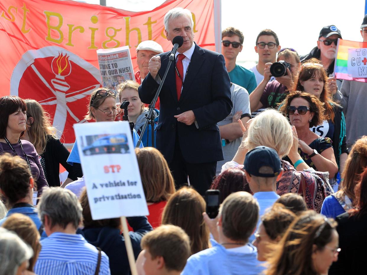 John McDonnell speaks to Labour supporters ahead of his conference speech in Brighton: PA