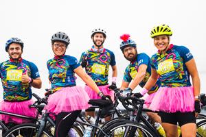 Riders stop at a rest stop for a photo opportunity.