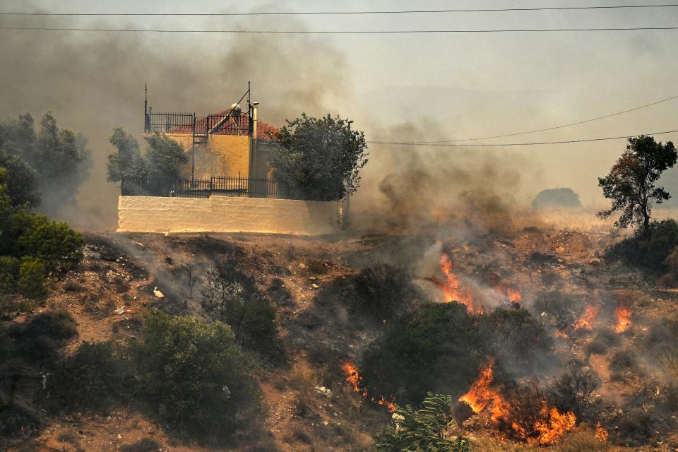 House threatened by a fire at the settlement of Kandyli, near Athens (AFP/Getty)