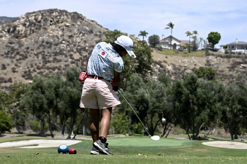 Miroku Suto of Japan hits her tee shot on the fifth hole during the final round at the Junior World Championships golf tournament held at Singing Hills Golf Resort on Thursday, July 14, 2022, in El Cajon, Calif. (AP Photo/Denis Poroy)