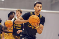 In this image provided by Milwaukee Athletics, Milwaukee freshman Patrick Baldwin works out during the Panthers’ first day of preseason NCAA college basketball practice, Tuesday, Sept. 28, 2021, in Milwaukee. Baldwin, rated as one of the nation’s top 10 prospects in his class, passed up offers from blueblood programs to play college basketball on a Milwaukee team that is coached by his father. (Ashley Steltenpohl/Milwaukee Athletics via AP)
