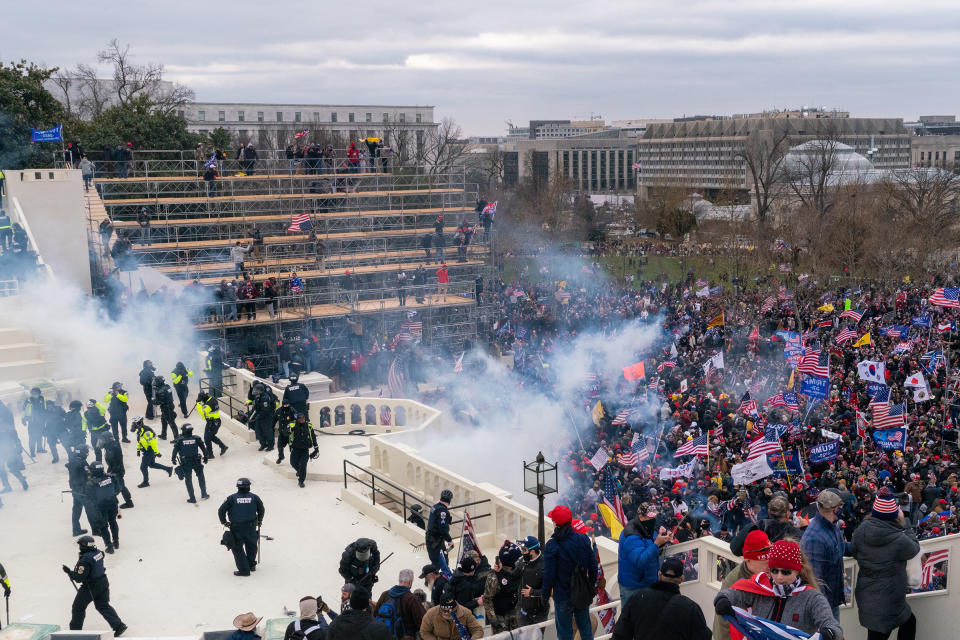 Rioters objecting to the certification of President-elect Joe Biden by Congress were briefly blocked by police outside the Capitol before gaining entry on Jan. 6. They wreaked havoc before being expelled.<span class="copyright">Peter van Agtmael—Magnum Photos for TIME</span>