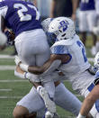 Indiana State's Geoffrey Brown (2) and a teammate stop North Alabama's ShunDerrick Powell during Indiana State's 17-14 overtime win in an NCAA college football game in Terre Haute, Ind., Sept. 1, 2022. On Sunday, Aug. 21, two members of the Indiana State team were killed in a single-car accident. Two others were hospitalized with serious injuries. In the blink of an eye, the whole season changed. (Joseph C. Garza/The Tribune-Star via AP)