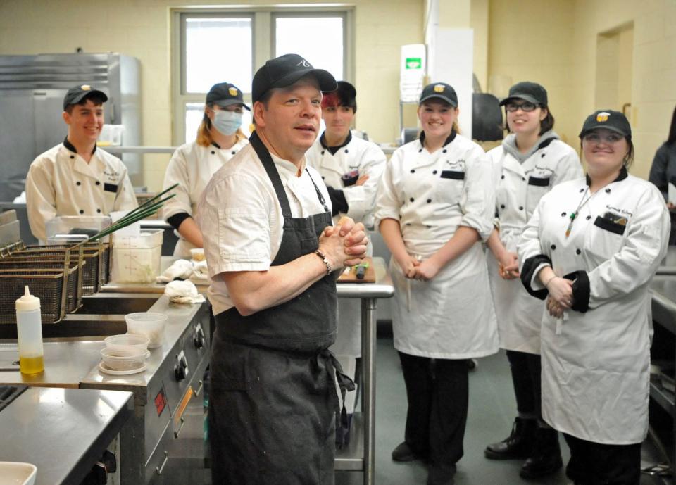 Chef Paul Wahlberg talks with Weymouth High School culinary students, from left, James Keyes, Elliot Johnson, Jonathan Tilden, Allison Wilt and Shannon Mahoney during a cooking demonstration for the Weymouth High School culinary students, Monday, April 11, 2022.