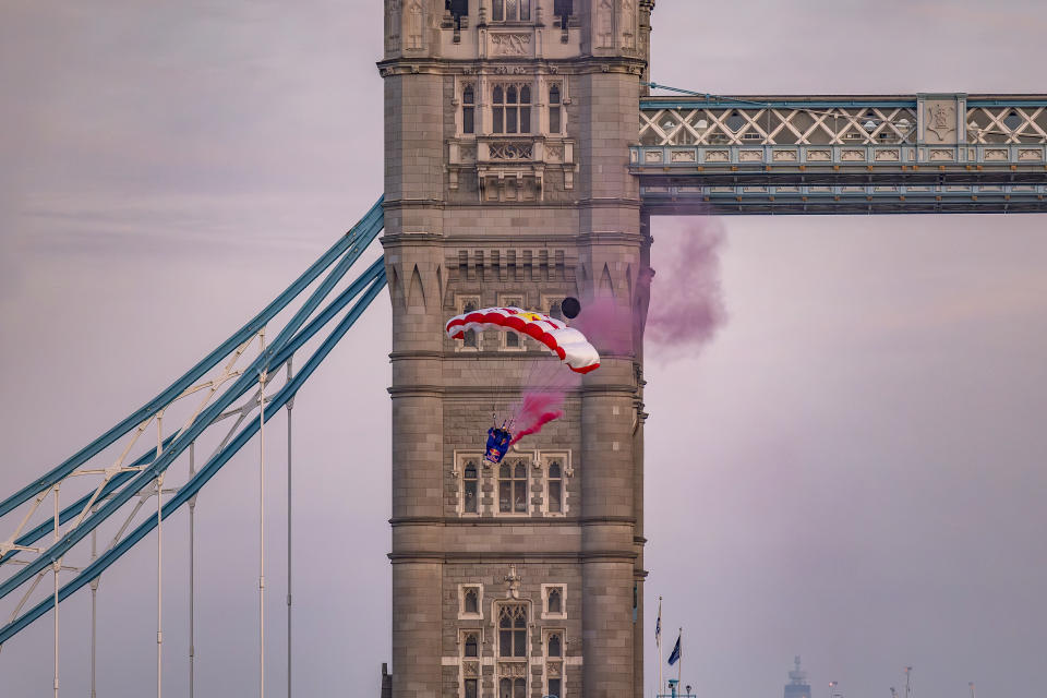 Marco Fuerst of Austria flies through Tower Bridge in London (Joerg Mitter/Red Bull/PA)