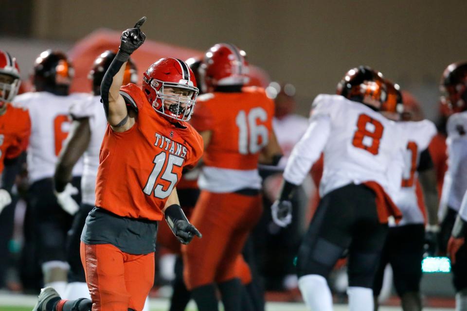 Carl Albert's Caden Davis (15) celebrates after a defensive stop during a high school football playoff game between Del City and Carl Albert in Midwest City, Okla., Friday, Nov. 18, 2022.