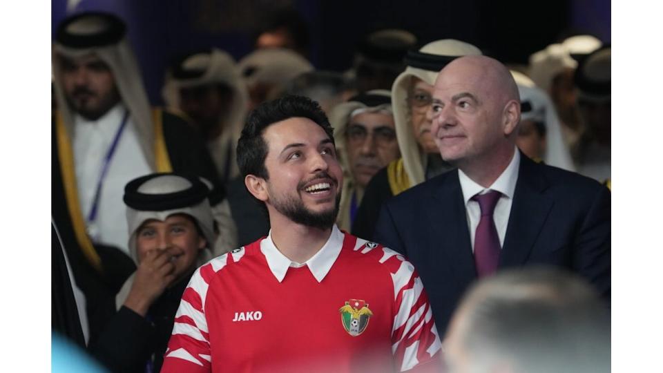 Crown Prince Hussein in a red football shirt