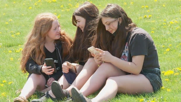 Grade 9 student Lilli Green, left, says 'it's been a challenge' trying to line up a summer job. She's been sending out resumés for the past two months.   (Steve Bruce/CBC - image credit)