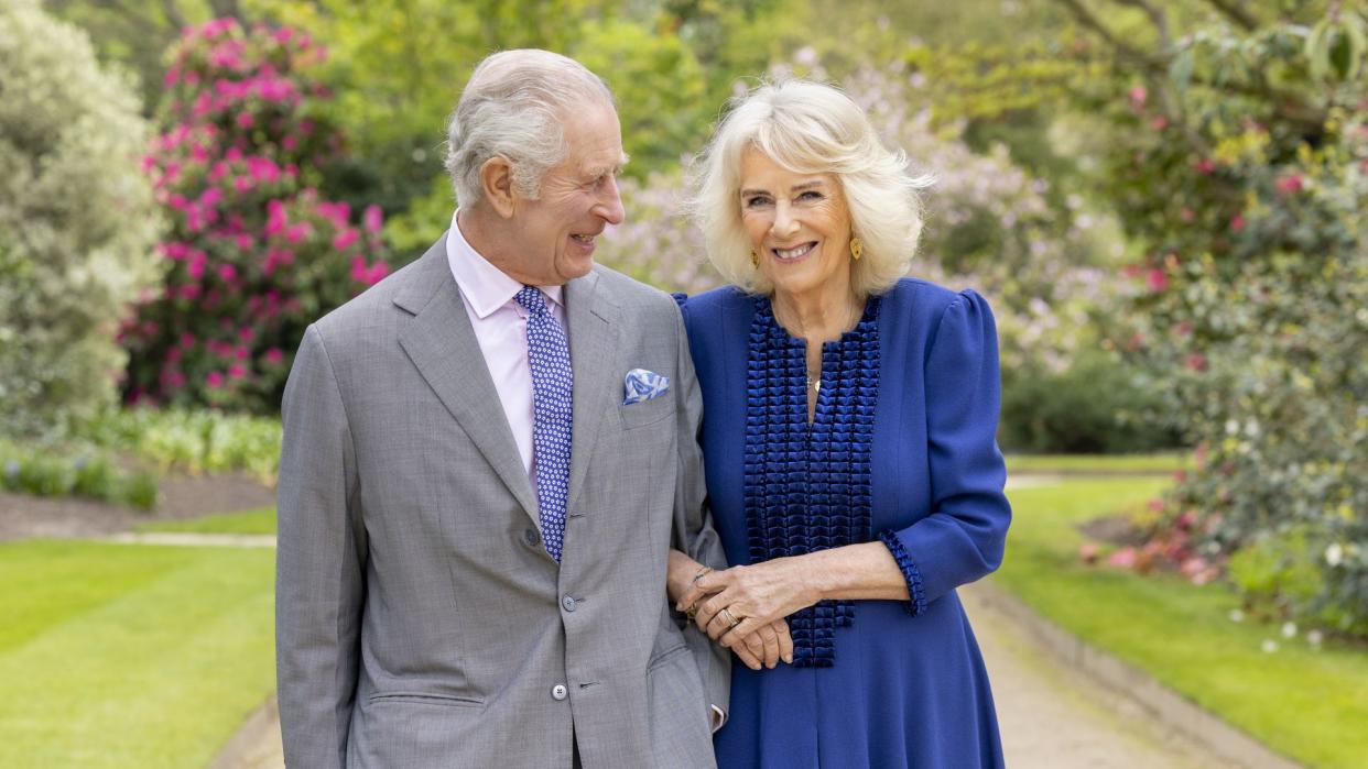 The King and Queen pictured in the gardens at Buckingham Palace