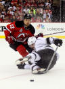 NEWARK, NJ - JUNE 09: Alexei Ponikarovsky #12 of the New Jersey Devils collides with Drew Doughty #8 of the Los Angeles Kings during Game Five of the 2012 NHL Stanley Cup Final at the Prudential Center on June 9, 2012 in Newark, New Jersey. (Photo by Elsa/Getty Images)